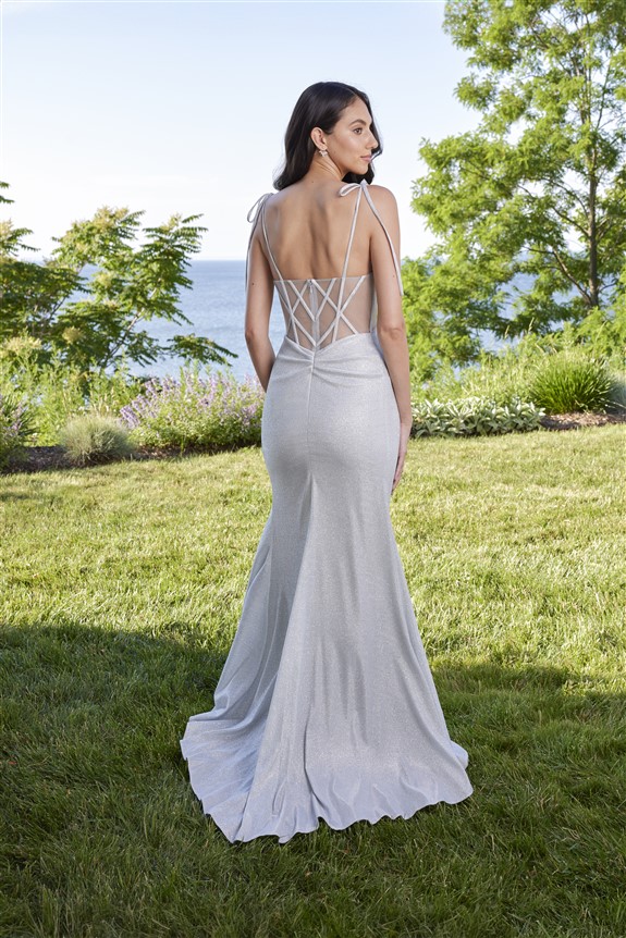 Silver fitted Mori Lee Prom Dress style 49186, with shear bodice and thigh split added detail of bow shoulder straps 